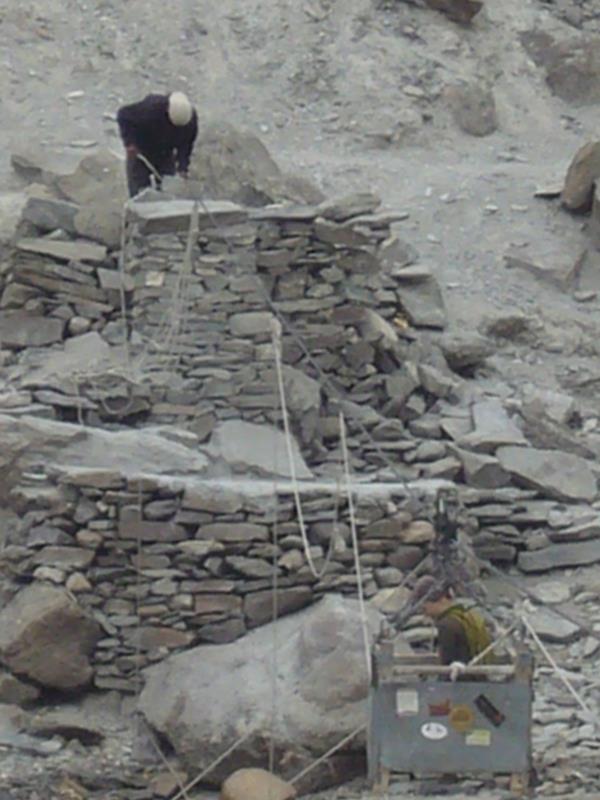and Tenzin has to climb down the steel cable to free the ropes.